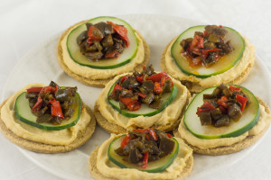 Hummus, cucumber & peppers on oatcake cracker